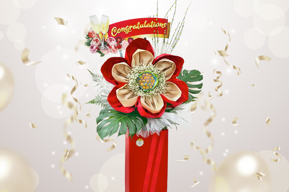 A red and gold grand opening flower stand featuring a double-layered cloth daisy with a lollipop bouquet as the centre.